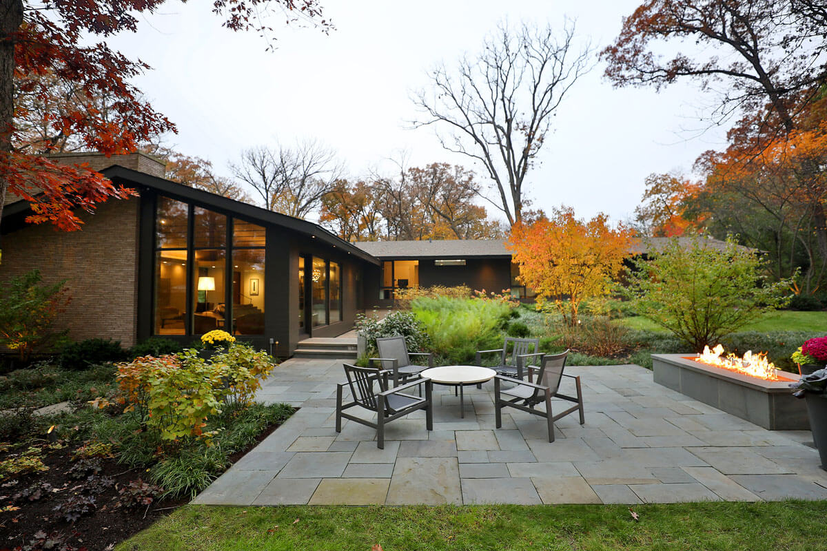 backyard patio and gas fire pit of landscape design project in Wheaton, IL