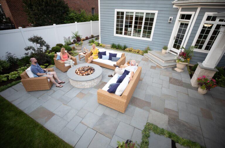 fire pit area of backyard design project in Western Springs, IL, completed by Hursthouse