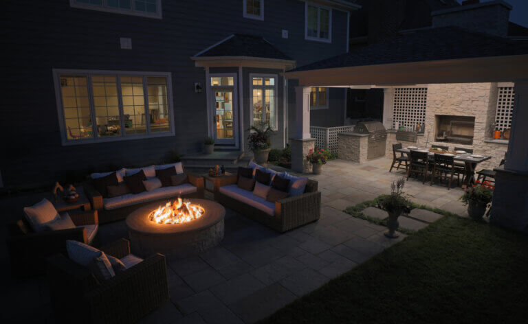 nighttime view of backyard design project in Western Springs, IL, completed by Hursthouse